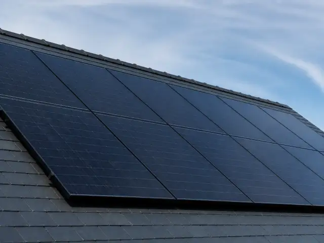 Illustrative roof-mounted solar panels shown for planning context.